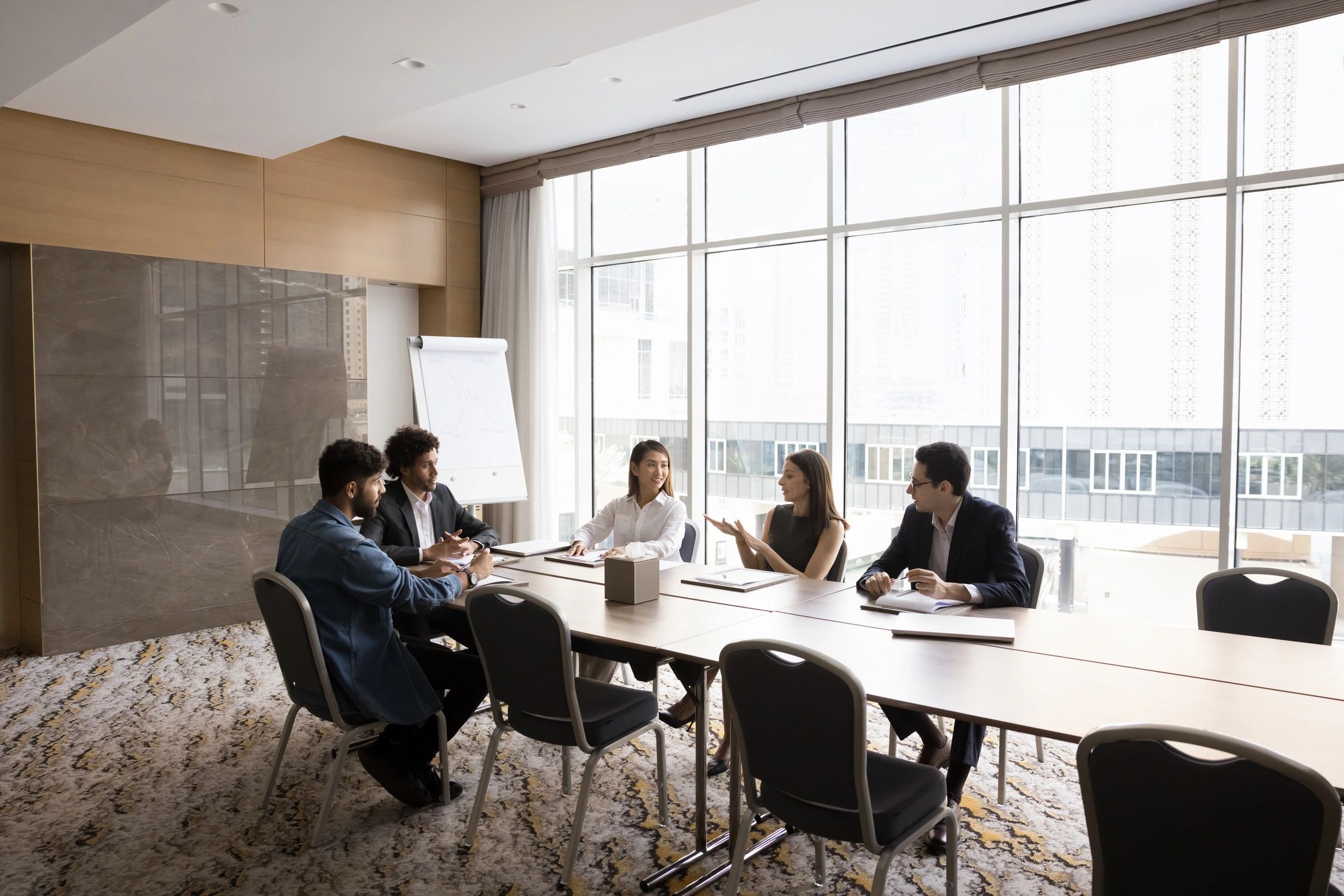 Faculty and staff collaborating around a conference table