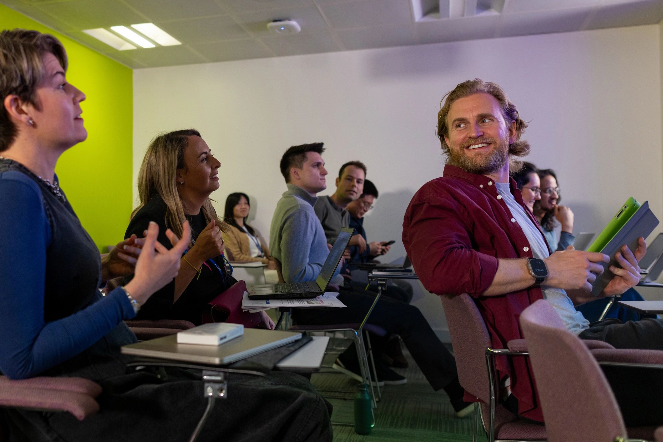 Students talking in a college classroom